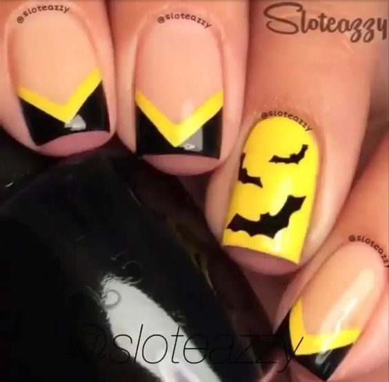 Желто-черный хэллоуинский квадратный маникюр с треугольными френч-кончиками и летучими мышами