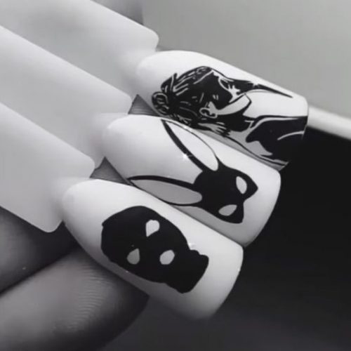 Провокационный маникюр в черном и белом цвете с рисунком девушки и разных ее сексуальных масок